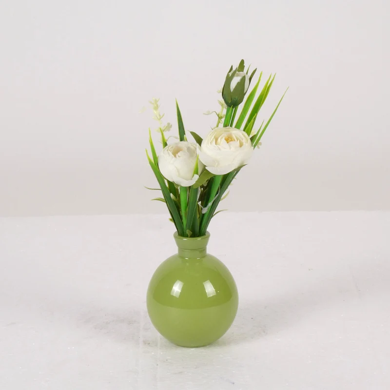 Ranunculus in green glass vase H22cm white