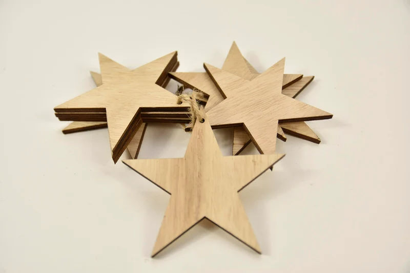 Bundel a 8 houten sterren 9,5cm natural