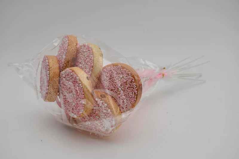 Pak á 8 Beschuit roze GROOT met lint op stok 50cm