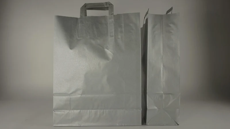 Draagtas zilver kraft 35+14x40cm a 50 stuks gedraaid handv.